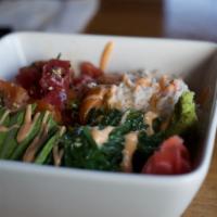 Classic Poke Bowl · Raw. Tuna, salmon, crab, wakame, and avocado, served over rice or mixed green salad.