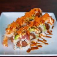 The Roll · Raw. Spicy tuna, shrimp tempura, and cucumber topped with tuna, salmon, hamachi, tempura cru...