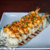 Silence Roll (Baked) · Shrimp tempura and crab, topped with scallops, spicy mayo, unagi sauce, tobiko, and green on...