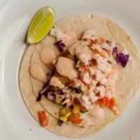 Blackened Fish Tacos · Cabbage slaw and chipotle dressing topped with pineapple salsa.