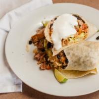 Roasted Pork Burrito · Comes with choice of: flour, wheat tortilla. Spicy black or pinto beans. Spanish or brown ri...