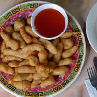 24. Sweet & Sour Chicken 甜酸鸡 · Chicken chunks lightly batter-dipped and fried until crisp, tossed in a sweet and sour sauce.