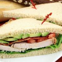 Oven Roasted Turkey Sandwich · Delicious sandwich topped with Oven Roasted Turkey, lettuce, tomato, onion, pickles, peppers...