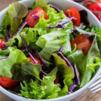 Garden Salad · Delicious side salad made with an assortment of mixed greens.