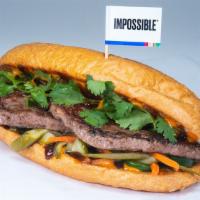 Take Bánh Mì · impossible patty, cilantro, jalapenos, hoisin sauce, spicy veganaise, pickled vegetables; se...