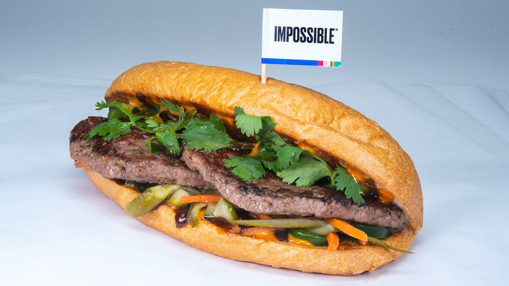TAKE BÁNH MÌ · impossible patty, cilantro, jalapenos, hoisin sauce, spicy veganaise, pickled vegetables; served on a vegan ciabattta roll