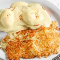 Classic Benedict · Classic eggs Benedict with Canadian bacon, poached eggs and hollandaise sauce.