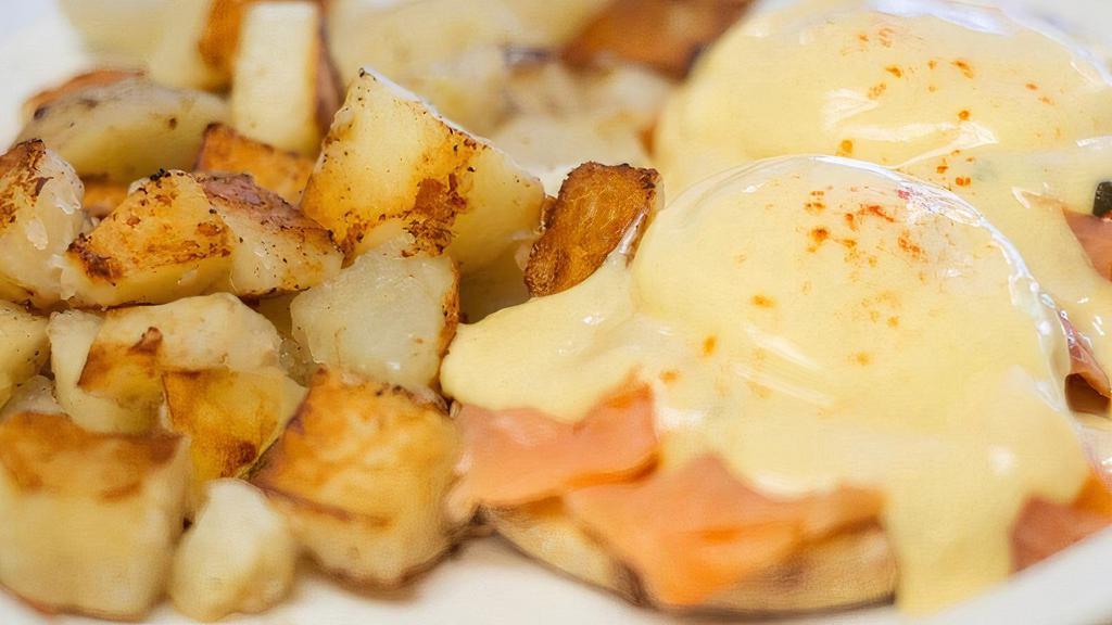Lox and Capers Benedict · Lox and capers on an English muffin topped with poached eggs and hollandaise sauce.