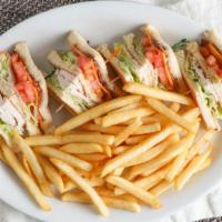 Club House · Turkey, bacon, lettuce, tomato, and cheddar cheese on your choice of bread. Served with a si...