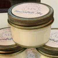 Candles - 4oz · Marmalade Sky Floral signature scent.  Candles locally made by Barely-Lit Candles.
