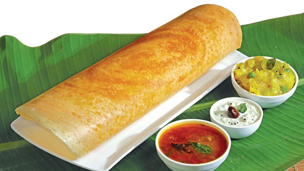 Plain Dosa · Classic South Indian thin crepe made of rice & lentil. Served with chutney & sambar.