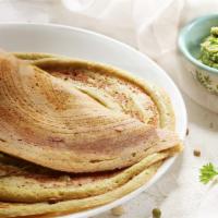 Coriander Dosa · Classic South Indian thin crepe made of rice & lentil spread with coriander chutney.