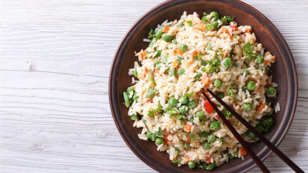 Veg. Fried Rice · Chinese classic preparation made from long grain basmati rice cooked with vegetables, garnished with scallions.