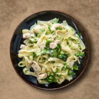 Chicken Fettuccini Alfredo Pasta · Fettuccine pasta smothered with fresh sauce and chicken.