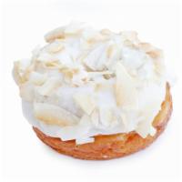 Vegan Coconut · Toasted coconut folded into our vegan dough. Dipped in a rich coconut milk glaze and dunked ...