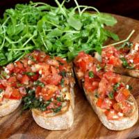 Bruschetta Salad · Vegetarian. Toasted bread, garlic, chopped tomatoes, and extra virgin olive oil. Served with...