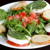 Caprese Salad · Vegetarian. Fresh tomatoes, fresh mozzarella, basil, extra virgin olive oil, balsamic vinega...