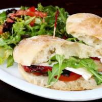 Vegetariano Sandwich · Vegetarian. Grilled eggplant, zucchini, tomatoes, peppers, and brie. Served with mix green a...