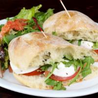 Caprese Sandwich · Vegetarian. Fresh tomatoes, fresh mozzarella, basil, and extra virgin olive oil. Served with...