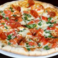 Primavera Pizza · Mozzarella, green onion, chopped pepperoni, chopped tomatoes, gorgonzola.