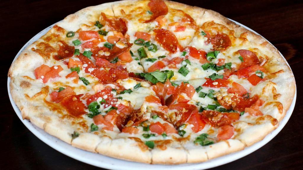 Primavera Pizza · Mozzarella, green onion, chopped pepperoni, chopped tomatoes, gorgonzola.