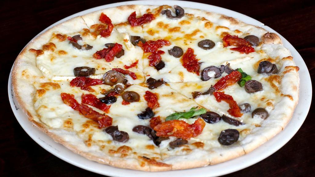 Romana Pizza · Vegetarian. Mozzarella, brie, olives, sun dried tomatoes, and basil.