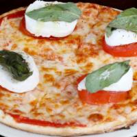 Caprese Pizza · Vegetarian. Fresh tomatoes, fresh mozzarella, tomato sauce, mozzarella, and basil.
