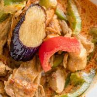 Duck Curry with Eggplant · Duck served in red curry, bamboo, bell peppers, egg plants, and basil.