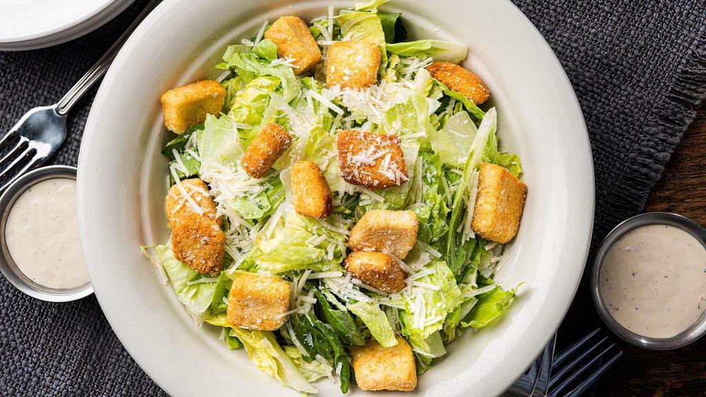 Caesar Salad · Chopped romaine lettuce, shredded parmesan, croutons. Served with our signature Caesar dressing on the side.
