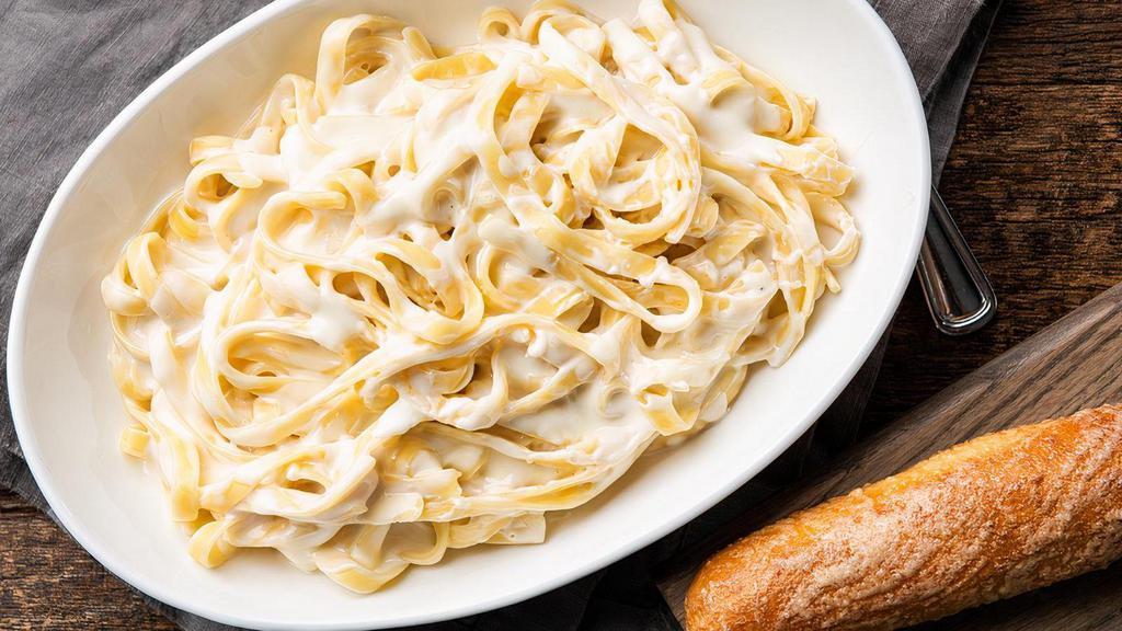 Fettucine Alfredo · Fettucine covered in our classic Alfredo sauce with shredded parmesan. Includes one breadstick.