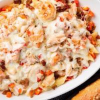 Baked Crab & Shrimp Alfredo · Fresh baked crab, garlic shrimp, diced red bell peppers and bacon over a bed of penne pasta ...