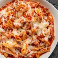 Baked Penne · Nonna's go-to meal is penne smothered in an Italian sausage marinara sauce and just enough g...