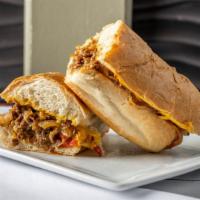 Philly Cheesesteak · Shaved ribeye steak, peppers and onions, American cheese.  ( Ask for add jalapeno )