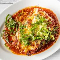 Short Rib Lasagna · Braised short ribs, portabella mushroom, mozzarella, pesto, tomato sauce, house ricotta, bas...