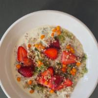 SWEET 3-GRAIN PORRIDGE · A creamy porridge topped with strawberry compote, sea buckthorn and cream