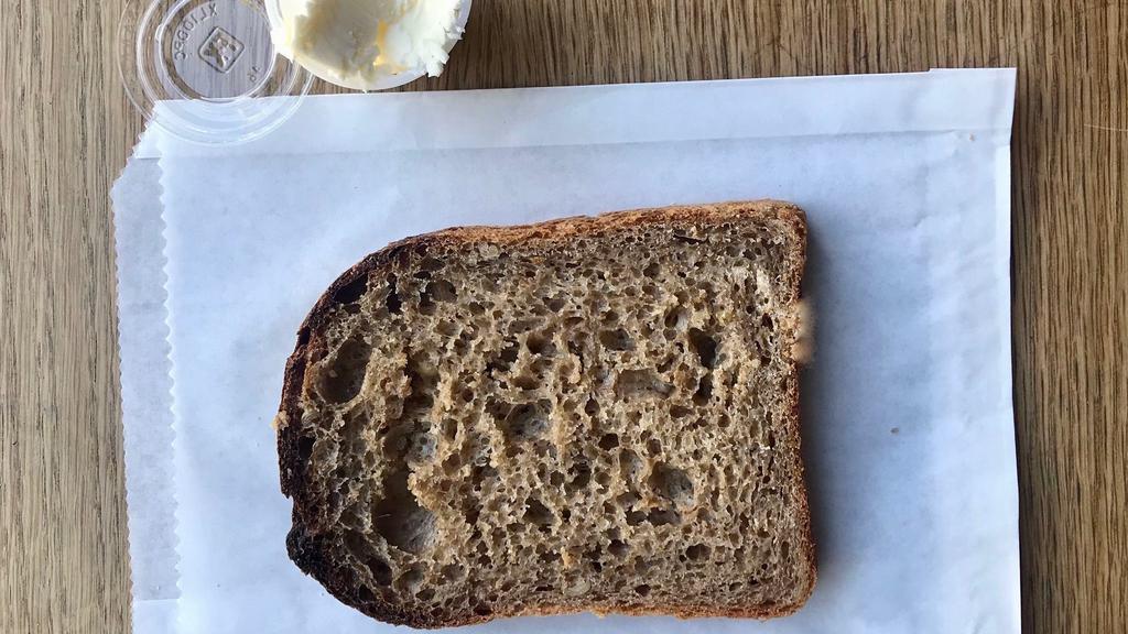 SIDE OF PORRIDGE SOURDOUGH (v) · A slice of our sourdough, whole wheat, ancient grains. Comes with salted butter.