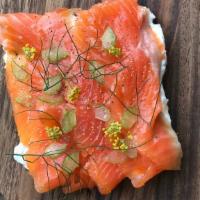CURED McFARLAND SPRINGS TROUT  OPEN-FACED SANDWICH · A slice of our sprouted Danish rye bread topped with herbed sour cream spread and slices of ...