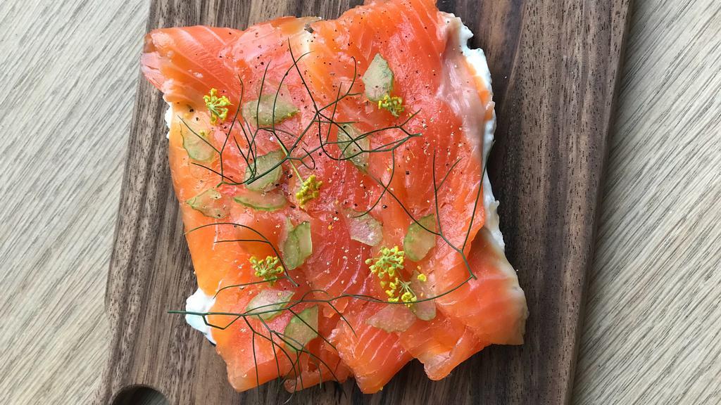 CURED McFARLAND SPRINGS TROUT  OPEN-FACED SANDWICH · A slice of our sprouted Danish rye bread topped with herbed sour cream spread and slices of house-cured McFarland Springs trout.