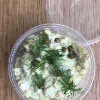 CURRIED PICKLED HERRRING SALAD · Creamy curry dressing with pieces of marinated herring, apple, capers and dill. 8oz. deli co...