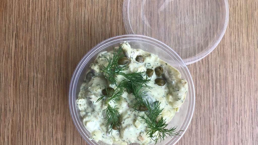 CURRIED PICKLED HERRRING SALAD · Creamy curry dressing with pieces of marinated herring, apple, capers and dill. 8oz. deli container