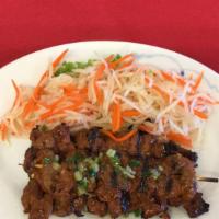 D9:Beef on a stick  · BBQ beef on bomboo sticks served w/pickle cabbage,shredded carrots and sliced cucumbers