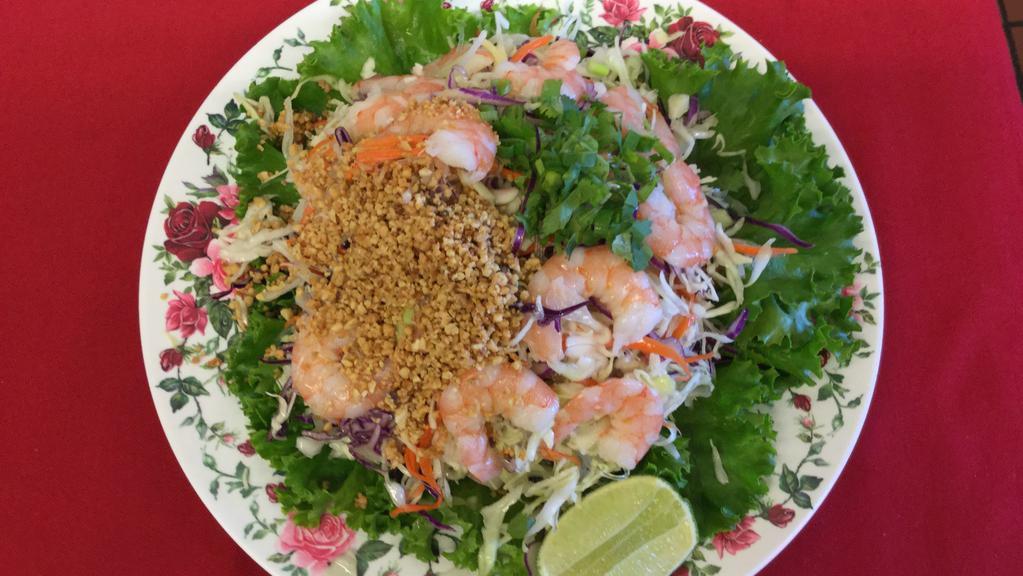 A2. Shrimp Salad · Shredded cabbage with mint in a vinaigrette dressing, shrimp, carrots, daikon, and crushed peanuts.