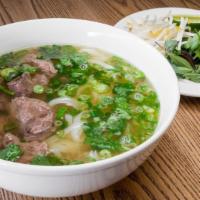 Braised beef Shank pho · fresh rice noodles, 12hr beef broth, scallions, cilantro, lime