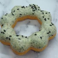 Black Sesame Mochi Donut · Mochi donut with black sesame chocolate and coated with black sesame sprinkles.