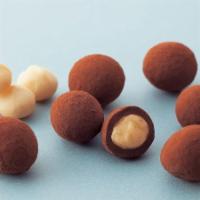 Macadamia Chocolate · This selection highlights savory macadamia nuts richly coated with milk chocolate and sprink...