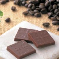 Coffee Beans Chocolate · Rare coffee beans from the Dominican Republic coated with mild milk chocolate.