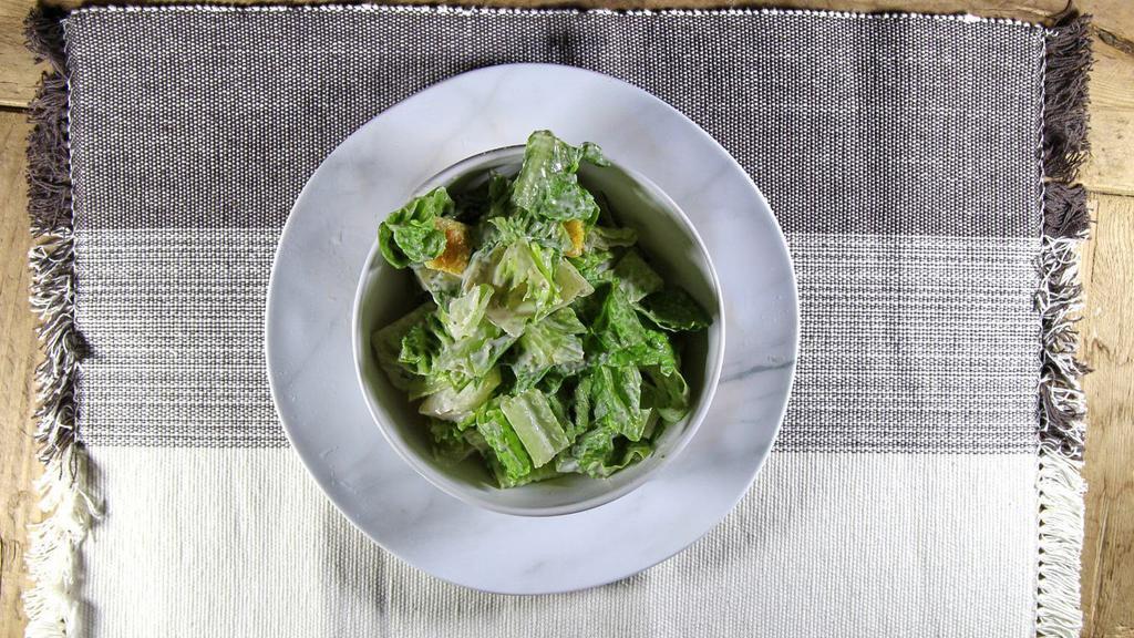 Caesar Salad · Parmesan croutons and homemade Caesar dressing. Anchovies upon request.