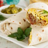 Huevos Mexicana Breakfast Burrito (peppers, onions, tomatoes, cheese, beans) · Sizzling fresh scrambled eggs, bell pepper, onion, tomatoes, cheese and beans. Served with c...
