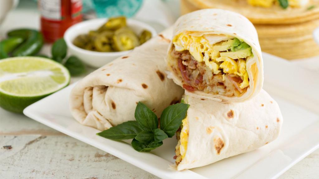 Huevos Mexicana Breakfast Burrito (peppers, onions, tomatoes, cheese, beans) · Sizzling fresh scrambled eggs, bell pepper, onion, tomatoes, cheese and beans. Served with chips & salsa