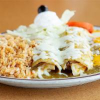 Enchiladas Suizas · Chicken enchiladas in green sauce, topped with jack cheese & sour cream.